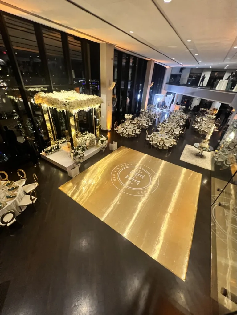 Mirror gold dancefloor reflecting warm ballroom light