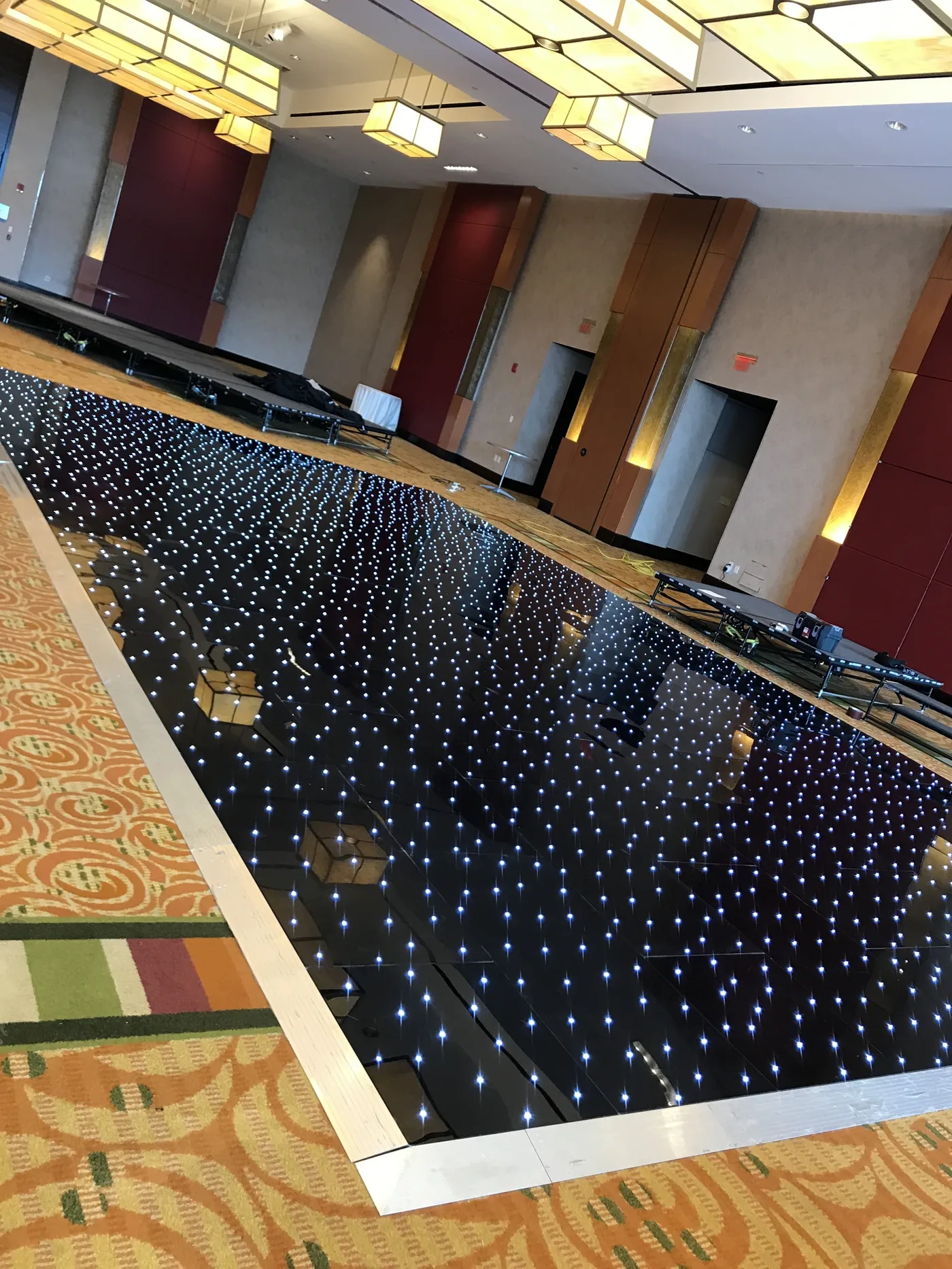 Black starlit LED dancefloor twinkling in daylight